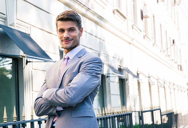 istock Businessman standing with arms folded 482823642