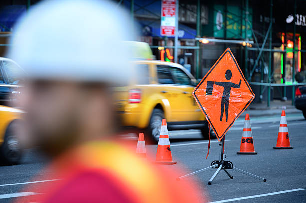 Roadwork on the NYC road Roadwork ongoing,  closed lane. barricade stock pictures, royalty-free photos & images