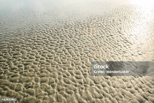 Textured Sand On Chesterman Beach At Low Tide Stock Photo - Download Image Now - 2015, Beach, Beige