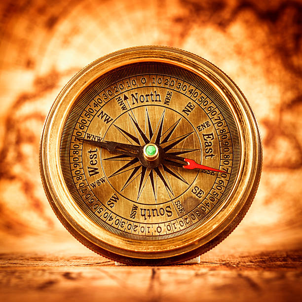 istock Vintage compass lies on an ancient world map. 482828778