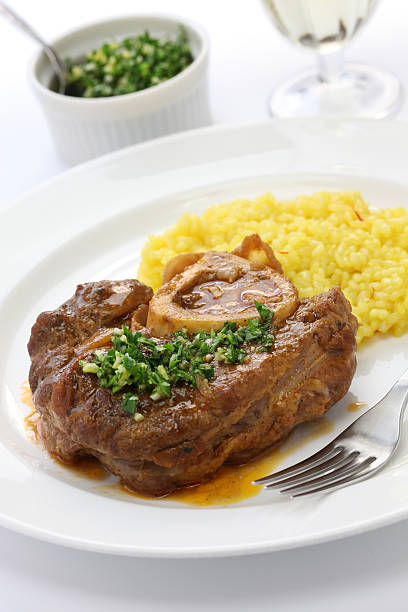 ossobuco alla milanese, Italian cuisine Ossobuco is a Milanese specialty of cross cut veal shanks braised with vegetables ossobuco stock pictures, royalty-free photos & images