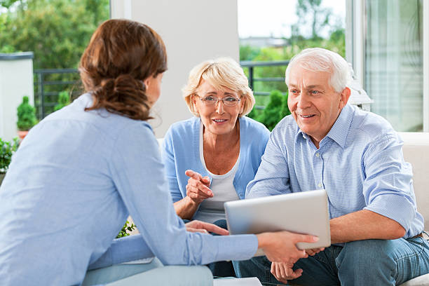 istock Senior couple talking with insurance agent 482834297