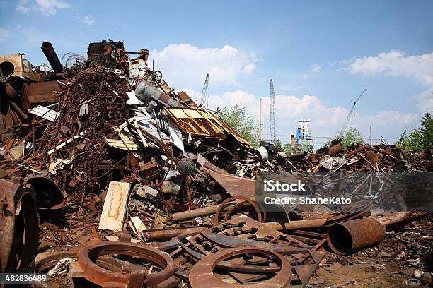 Junkyard Scrap Metal And Shipping Port Stock Photo - Download Image Now - Blue, Broken, Cloud - Sky