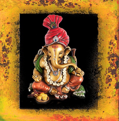 Idol of Ganesha in a decorative picture frame on Ganesha Chaturthi.