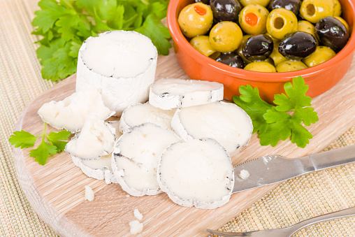 Goat's Cheese & Olives - Full fat mould ripened soft goat's milk cheese served with mixed olives.