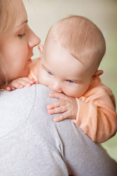 istock Young mother holding a baby 482837629