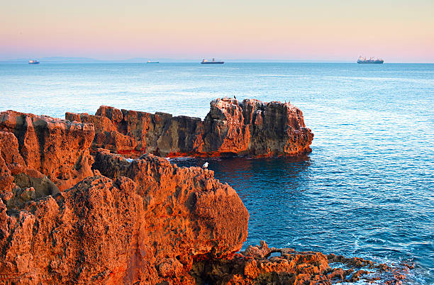 The rocky coastline of Cascais - famous tourist destination. Portugal