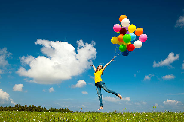flying with balloons - kvinna ballonger bildbanksfoton och bilder