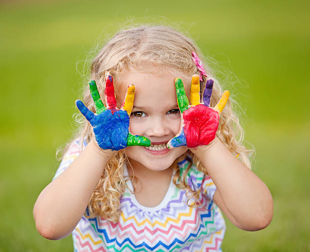 istock Girl With Painted Hands Outdoors 482838375