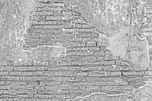 istock White weathered brick wall and cement fragment 482838939