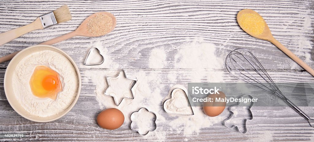ingredients and molds for baking cookies on wooden background Backgrounds Stock Photo