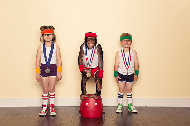 Chimpion This group of young friends are all workout winners. The chimpanzee is the champion. crossfit girl stock pictures, royalty-free photos & images