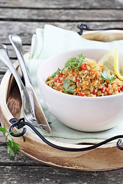 istock Quinoa salad with vegetables,herbs and lemon. 482840906