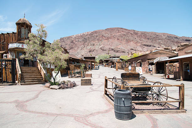 Calico, California, United States - May 21, 2015: View at the main street in the Calico ghost town in the desert of California very close to Nevada. Calico is an old west mining touristic village that has been around since 1881. Image taken during daytime.