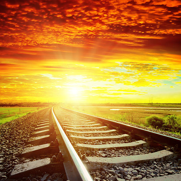 istock red  sunset and railroad to horizon 482840993