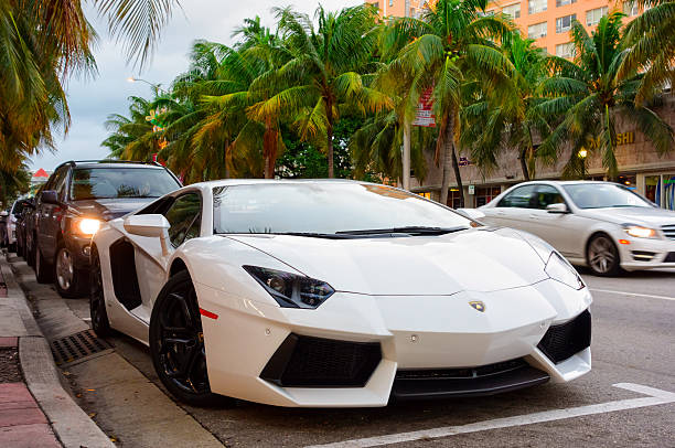 Miami Beach, USA - November 30, 2013: A white colored Lamborghini Aventador LP 700-4 luxury sports car parked on Washington Avenue in Miami Beach, Florida.
