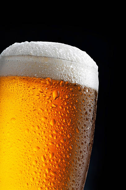 istock glass of beer on dark blue background 482844142