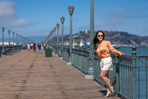 Happy woman travel in San Francisco relax feel free, asian from China