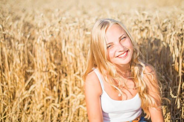 istock Young girl is smiling in the field 482845930