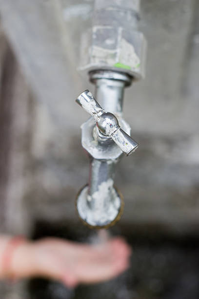 Water comes out from the Faucet, with the hand below
