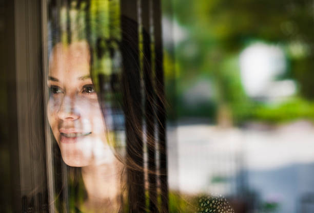 istock Woman Portrait at Window 482849992