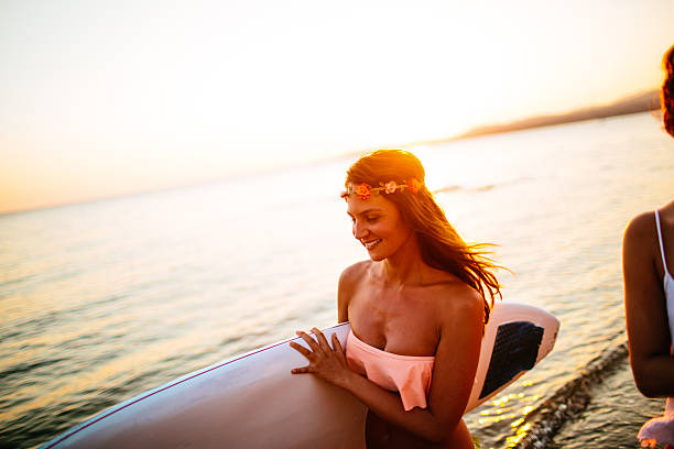 istock Smiling surfer girl 482850044