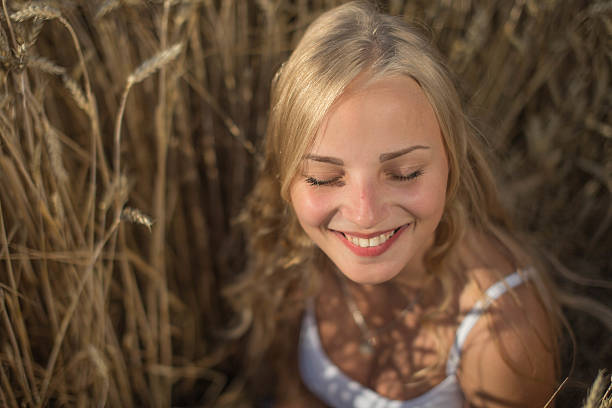 istock Young girl is smiling in the field 482851156