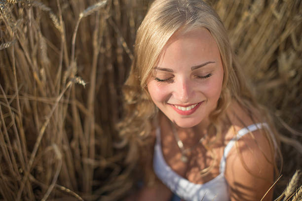 istock Young girl is smiling in the field 482851164