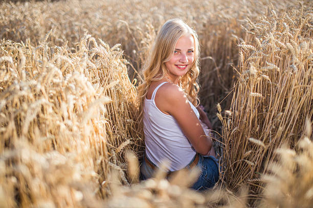 istock Young girl is smiling in the field 482851636