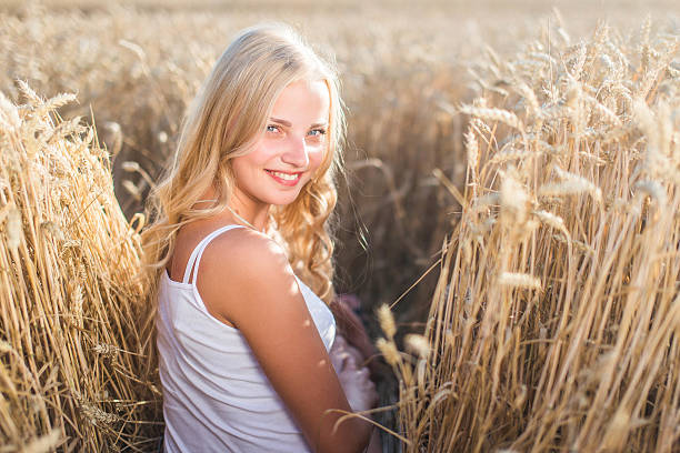 istock Young girl is smiling in the field 482851640