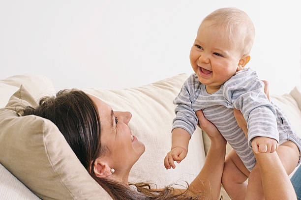istock Mother and baby playing together 482853771