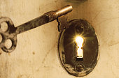 Antique Skeleton Key With Light Beams from Keyhole