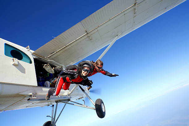 Jump Parachuters jumping from the plane skydiving stock pictures, royalty-free photos & images