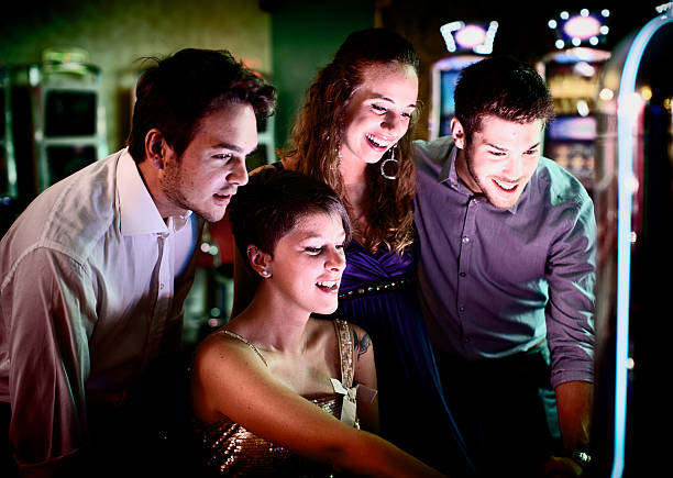 istock Friends gambling on slot machines 482855005