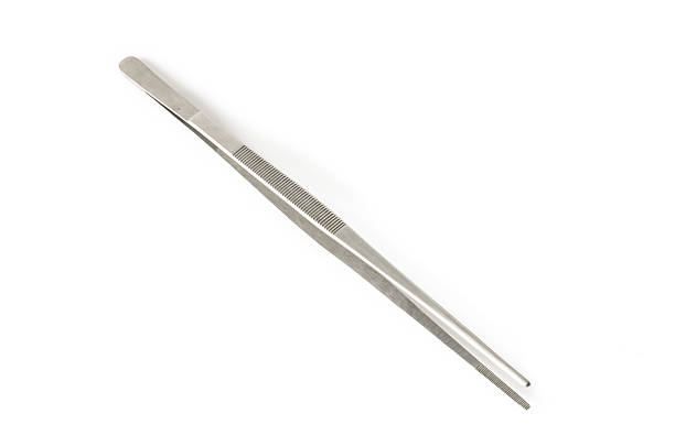 istock metal tweezers isolated over the white background 482855164