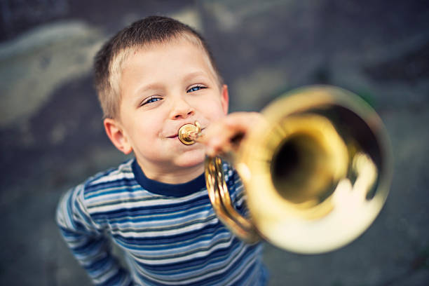 szczęśliwy mały trumpeter - little boys only playing preschooler child zdjęcia i obrazy z banku zdjęć