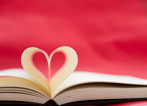 heart Opened book with heart shape of pages. book heart shape valentines day copy space stock pictures, royalty-free photos & images