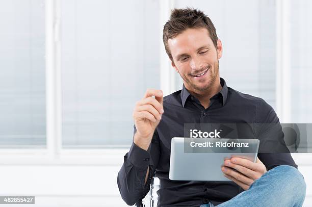 Young Man With Digital Tablet Stock Photo - Download Image Now - Digital Tablet, Happiness, Men