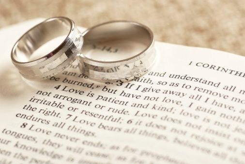 Two rings on open Bible - 1. Corinthians chapter 13.