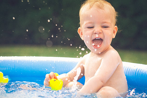 istock Baby splashing water in the small pool 482855640