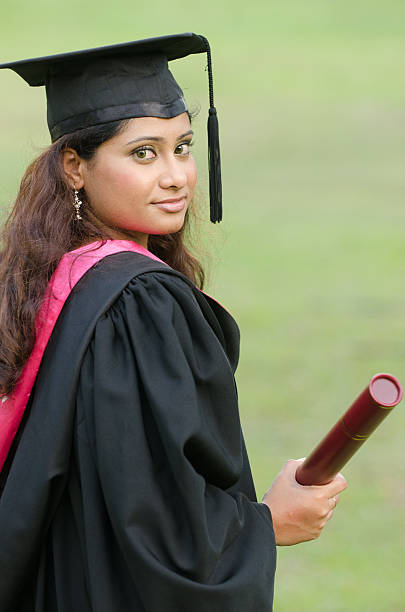 istock indian female graduate with green background 482855807