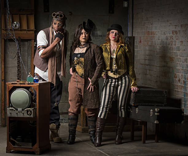 Steampunk Trio Three Young Diverse Steampunks in Retro Lair steampunk pistol pictures stock pictures, royalty-free photos & images