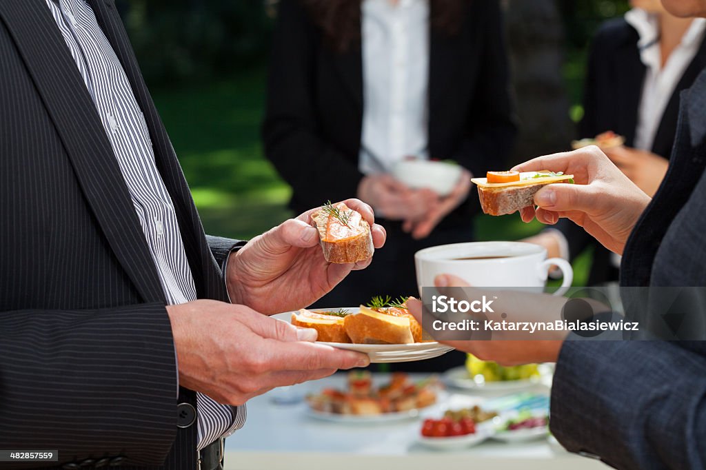 Business lunch in the garden Business people who are eating lunch in the garden Breakfast Stock Photo