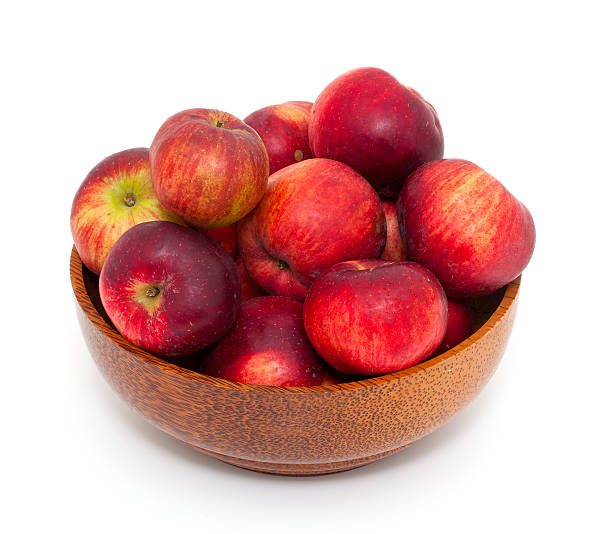 istock apples in a wooden bowl 482857855