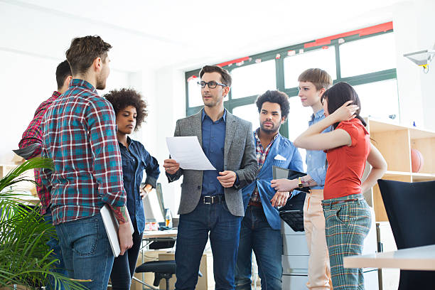 istock Colleagues at a stand up meeting 482858423