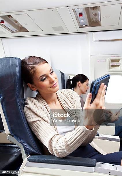 During The Flight Stock Photo - Download Image Now - Airplane, E-Reader, 20-24 Years