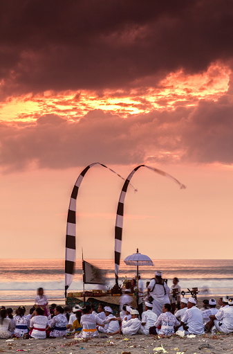 Bali, Indonesia - March 28, 2014: Nyepi ceremony in Bali, the Hindu people pray on the beach and give offerings to the sea to purify the land from the bad spirits.