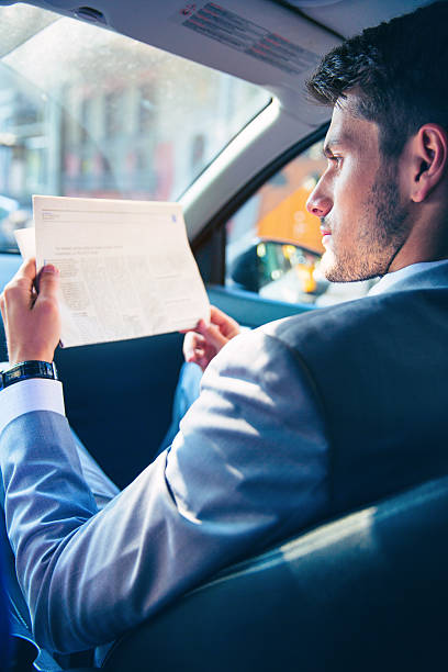 istock Businessman reading newspaper 482875642