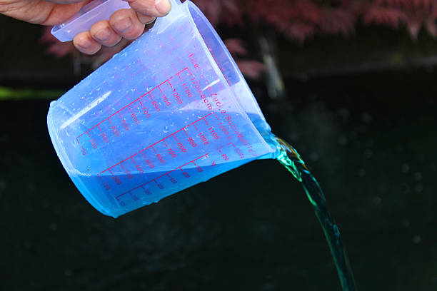 istock Image of koi pond being medicated with malachite / formalin medication 482876482