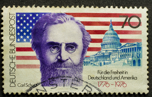 German post stamp with carl schurz with an american flag. for freedom in Germany and America written post.